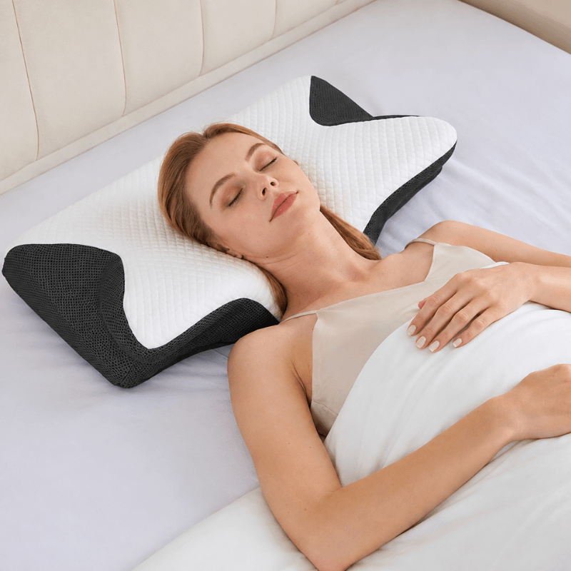Back sleeper with her head in the contoured centre of the NeckEase pillow
